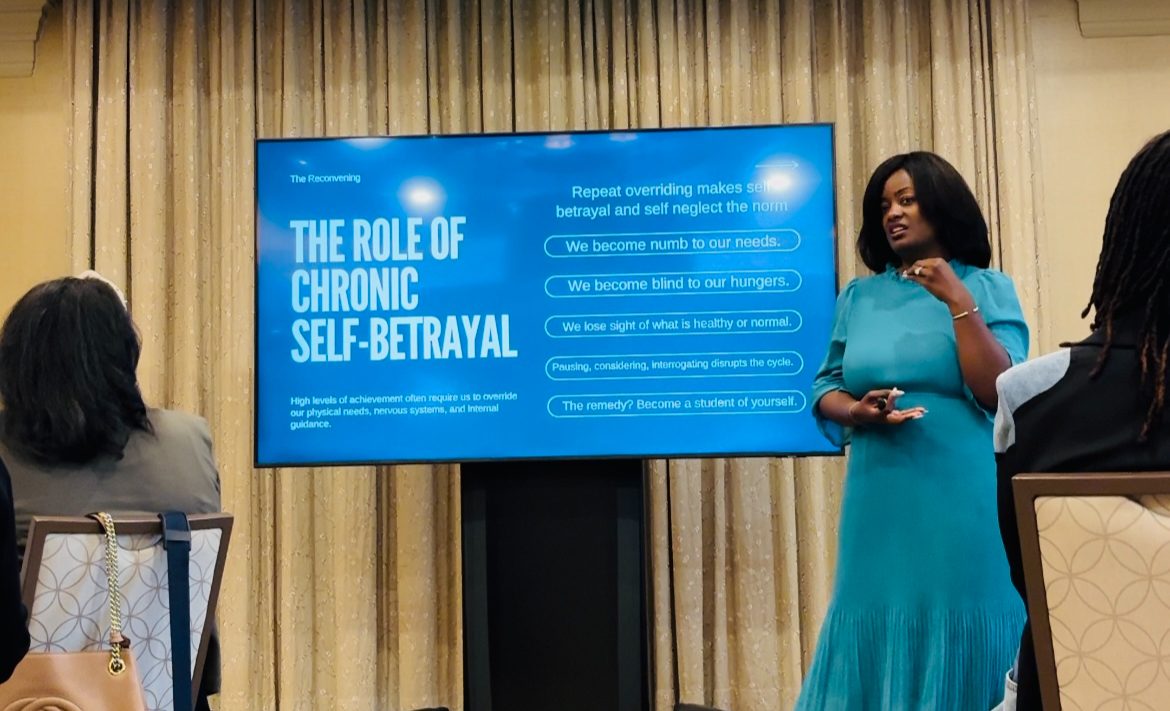 Amanda Miller Littlejohn speaking on stage about chronic self-betrayal
