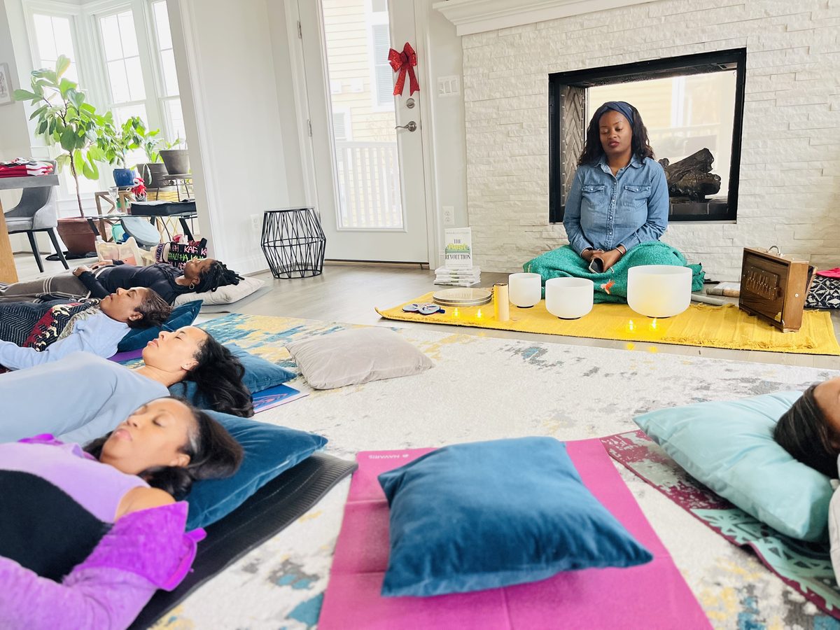 Participants resting under blankets during a group sound bath